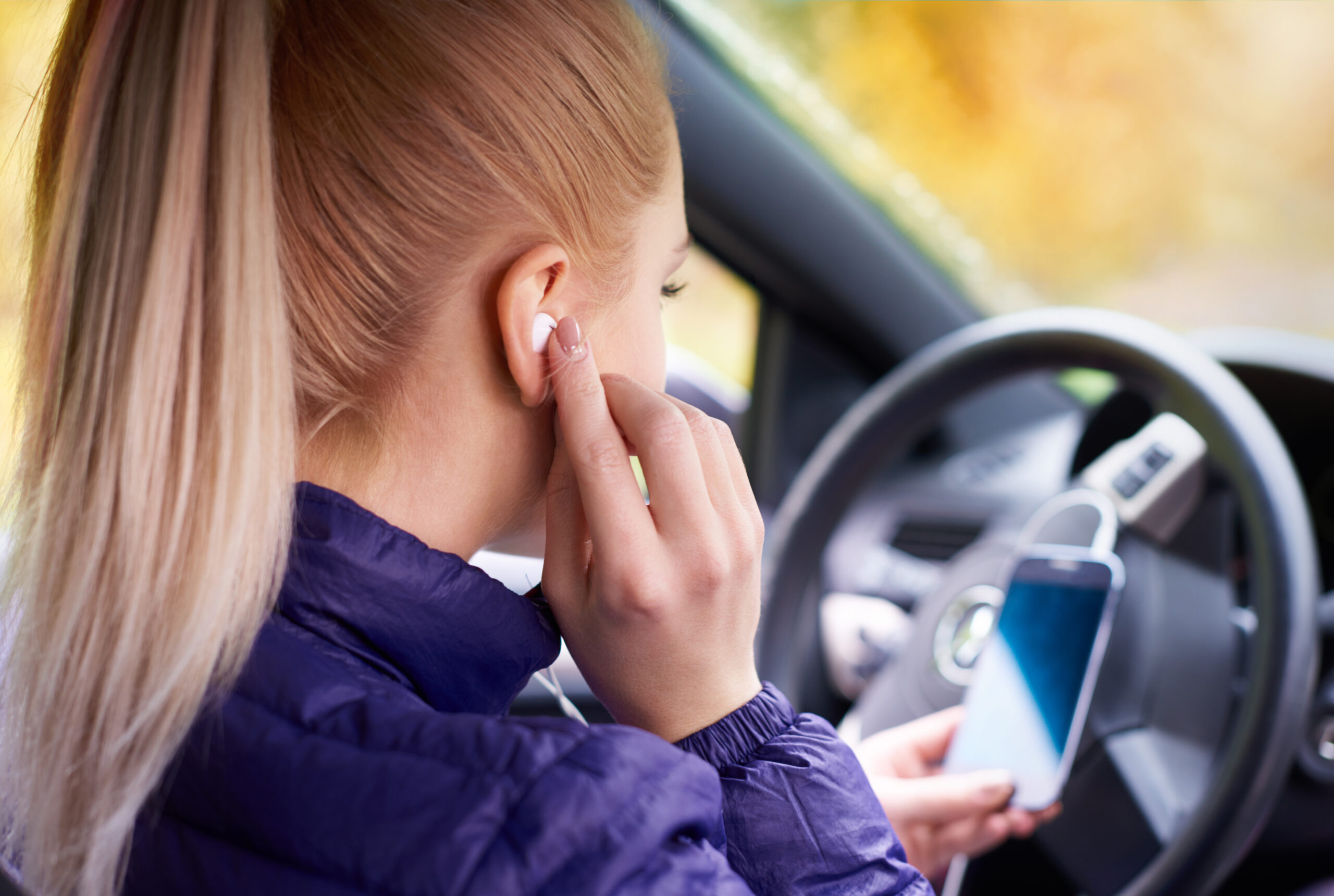 can you wear one earbud while driving